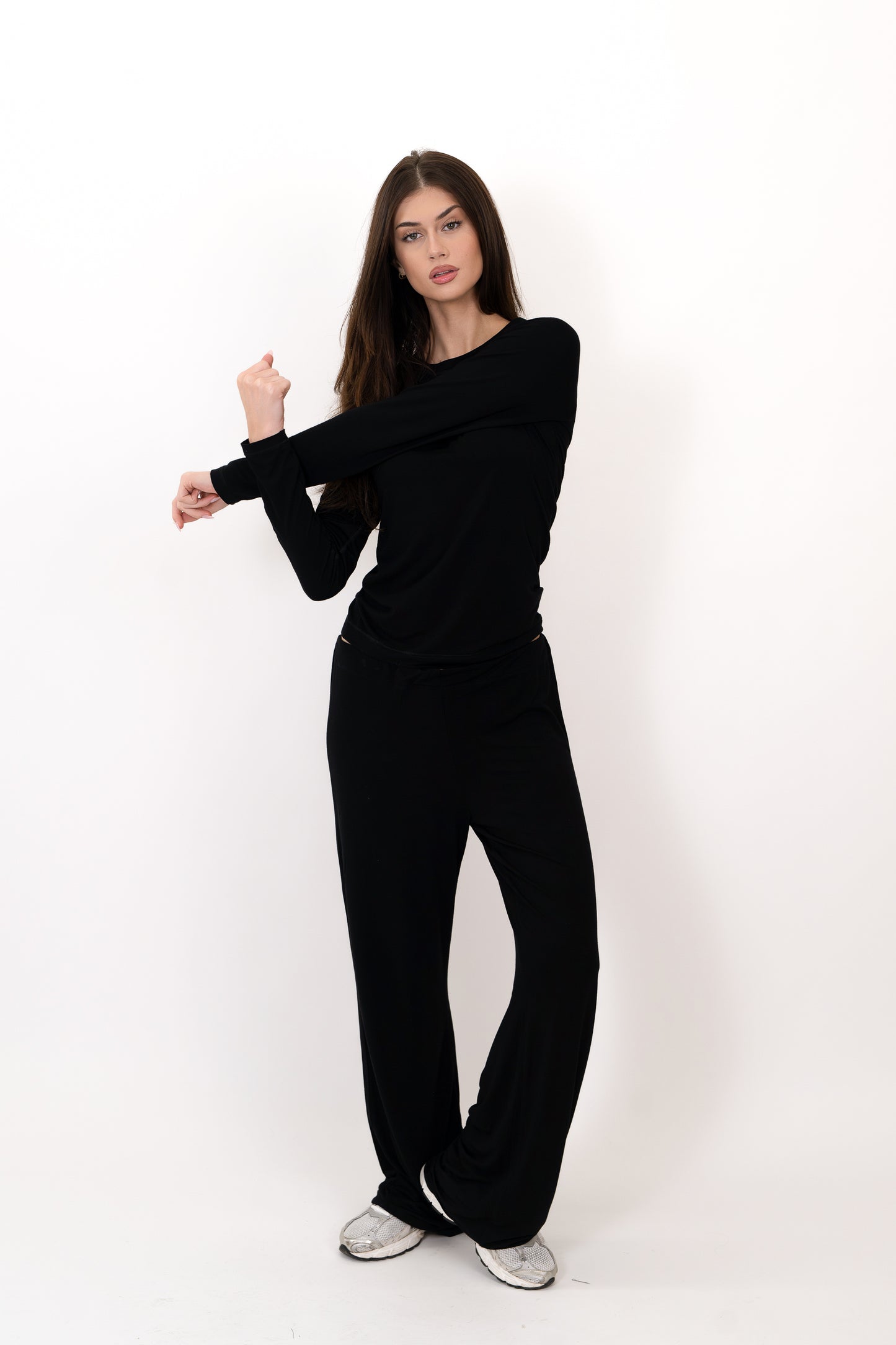 Model wearing The Everyday Long Sleeve in Onyx by ON/OFF Essentials, made from 95% bamboo.