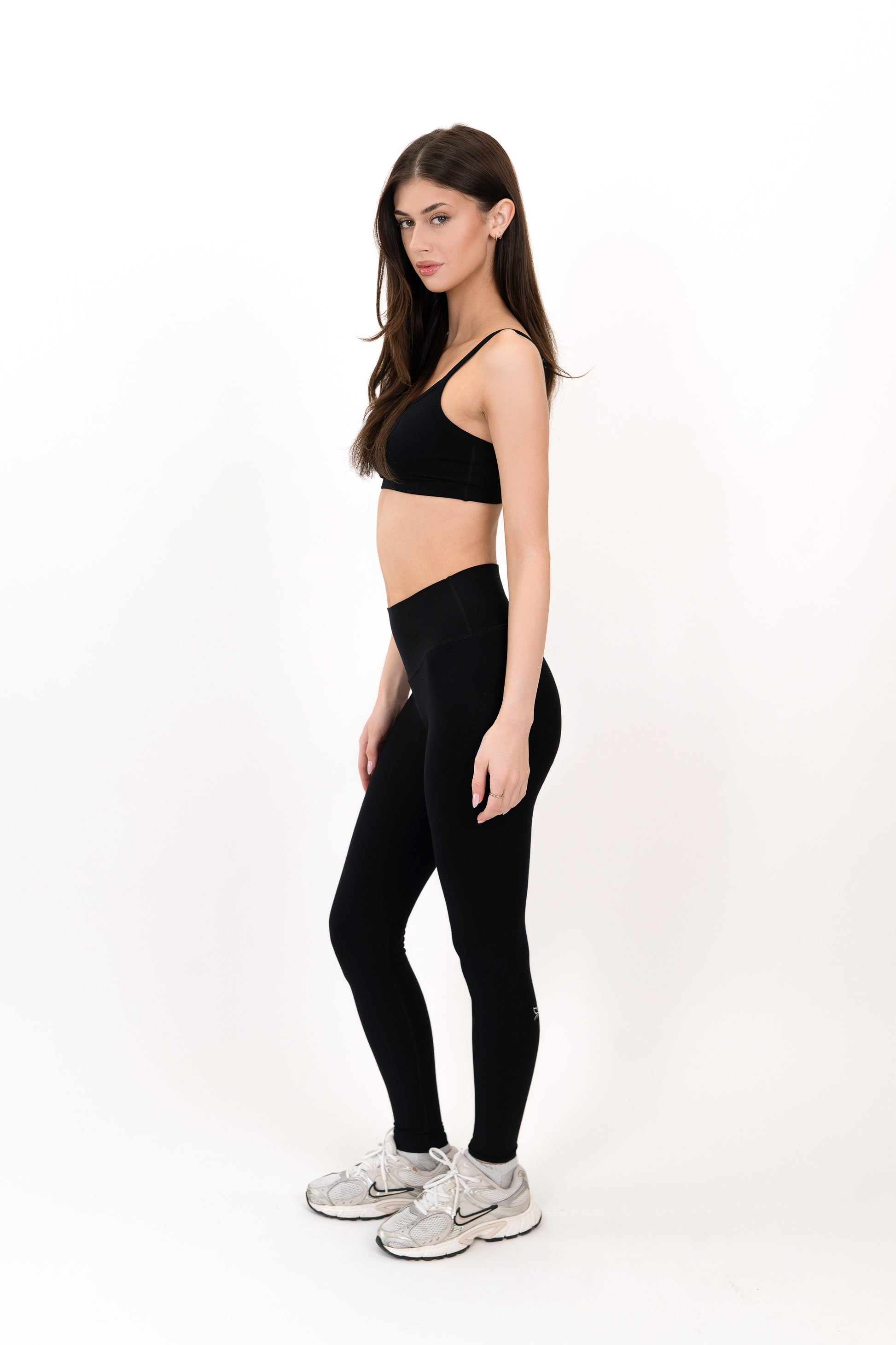Model wearing The Core Legging in Onyx by ON/OFF Essentials, made from 95% bamboo.