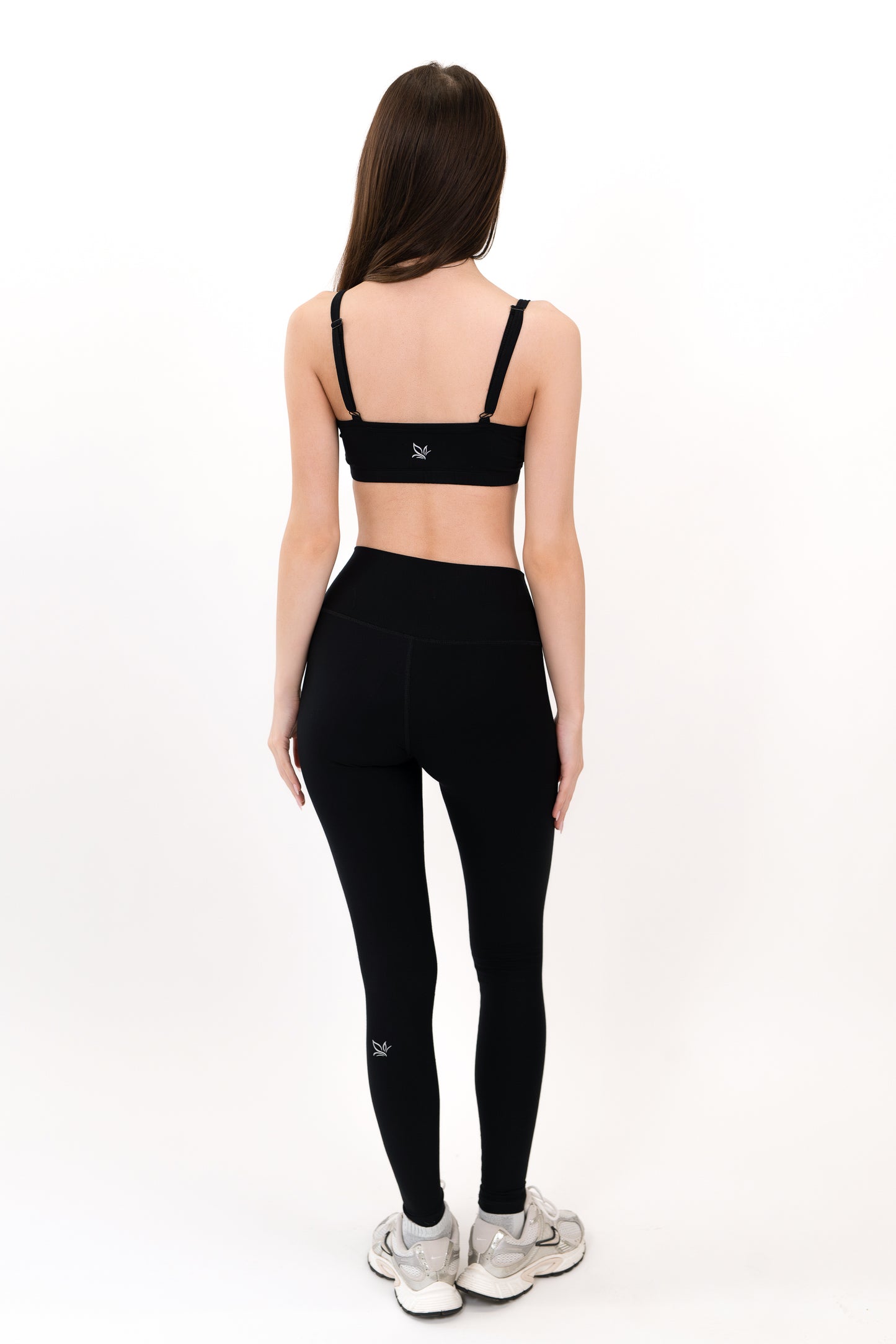 Model wearing The Core Legging in Onyx by ON/OFF Essentials, made from 95% bamboo.