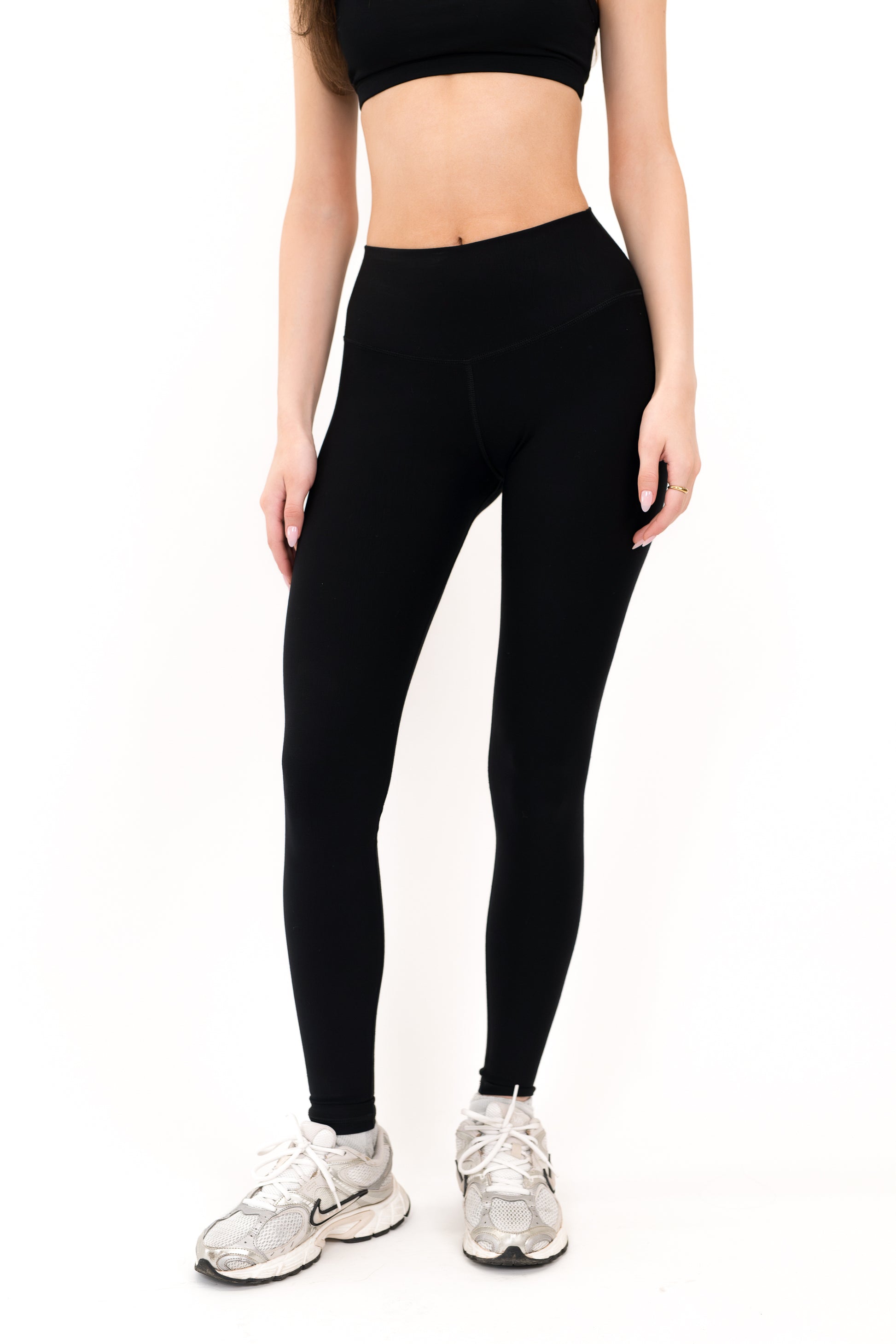Model wearing The Core Legging in Onyx by ON/OFF Essentials, made from 95% bamboo.