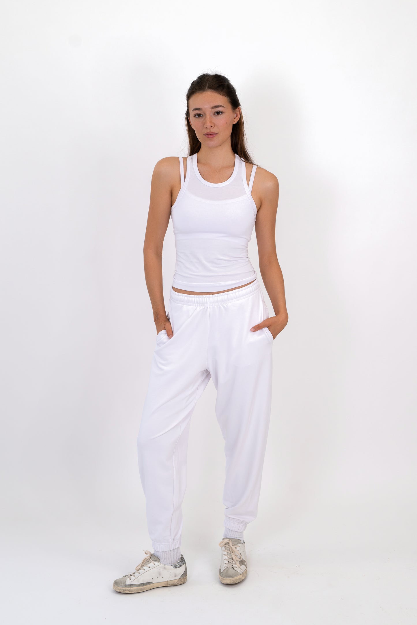 Model wearing The Solace Sweatpant in Cloud by ON/OFF Essentials, made from 95% bamboo fleece.