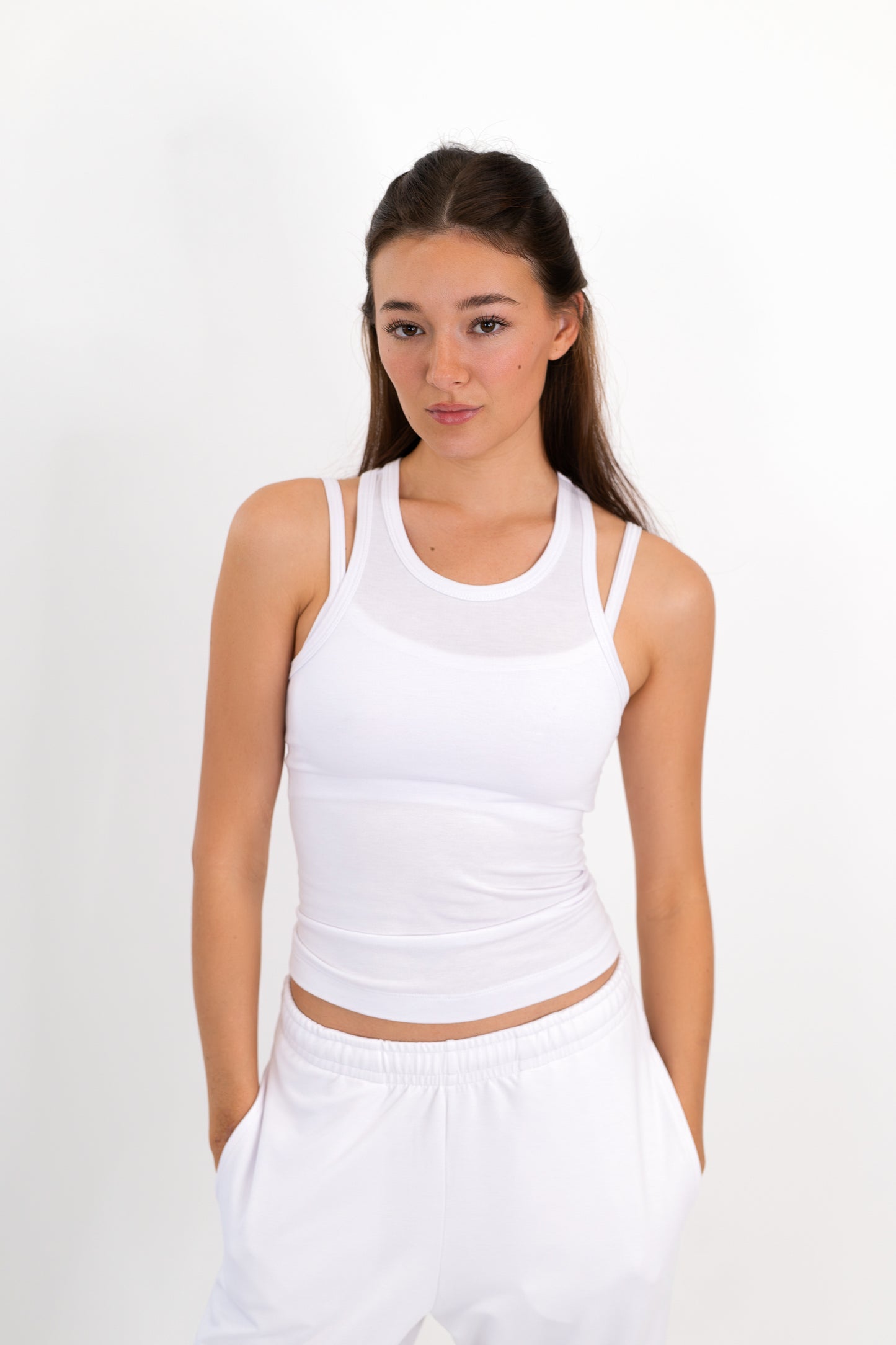 Model wearing The Essential Tank in Cloud by ON/OFF Essentials, made from 95% bamboo.