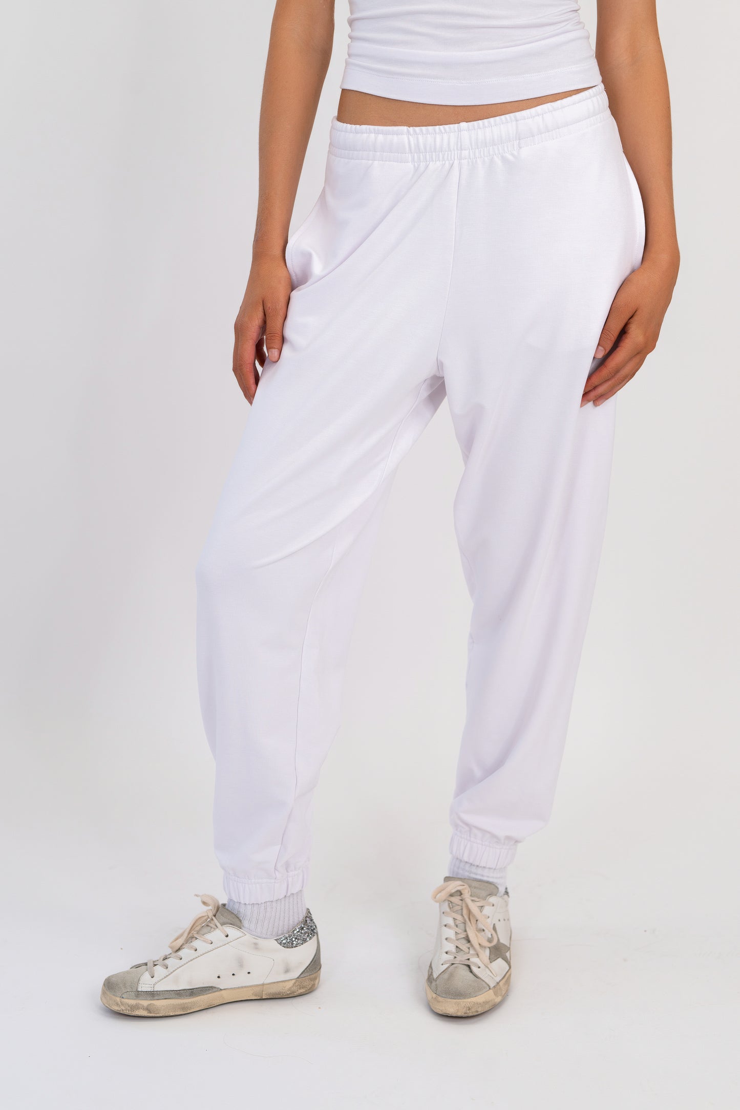 Model wearing The Solace Sweatpant in Cloud by ON/OFF Essentials, made from 95% bamboo fleece.