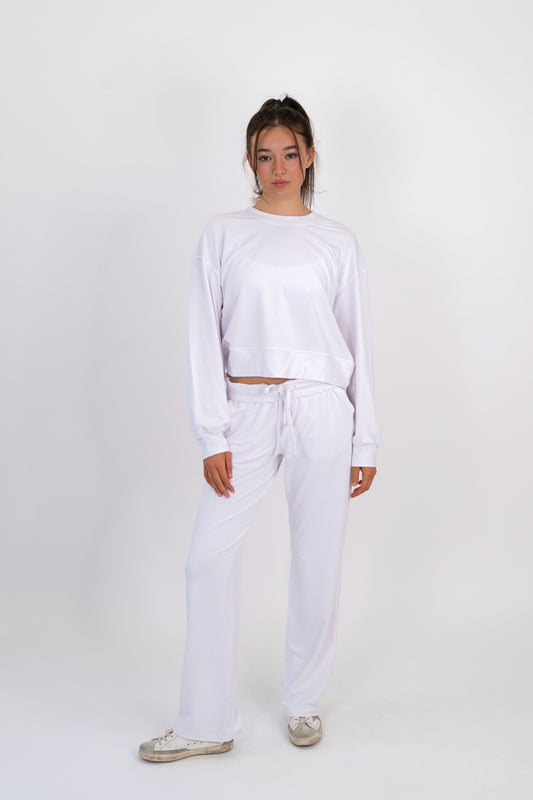 Model wearing The Solace Wide Leg Sweatpant in Cloud by ON/OFF Essentials, made from 95% bamboo fleece.