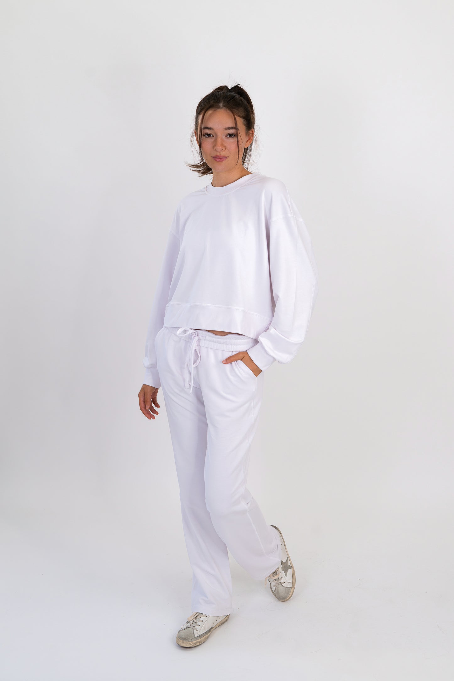 Model wearing The Solace Crew Neck in Cloud by ON/OFF Essentials, made from 95% bamboo fleece.