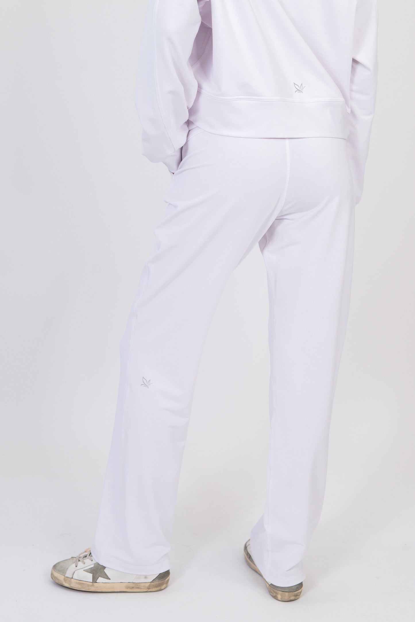 Model wearing The Solace Wide Leg Sweatpant in Cloud by ON/OFF Essentials, made from 95% bamboo fleece.