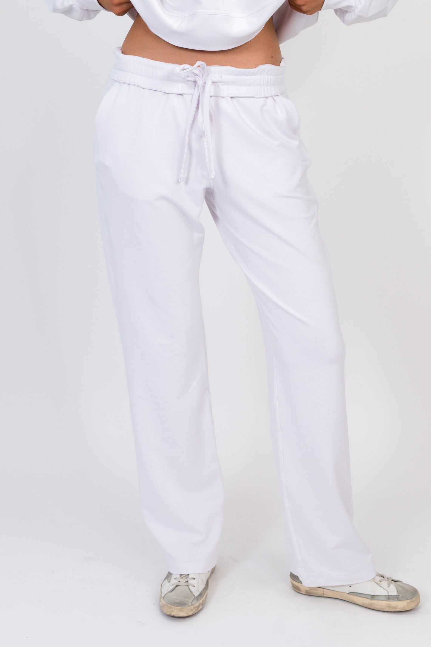 Model wearing The Solace Wide Leg Sweatpant in Cloud by ON/OFF Essentials, made from 95% bamboo fleece.