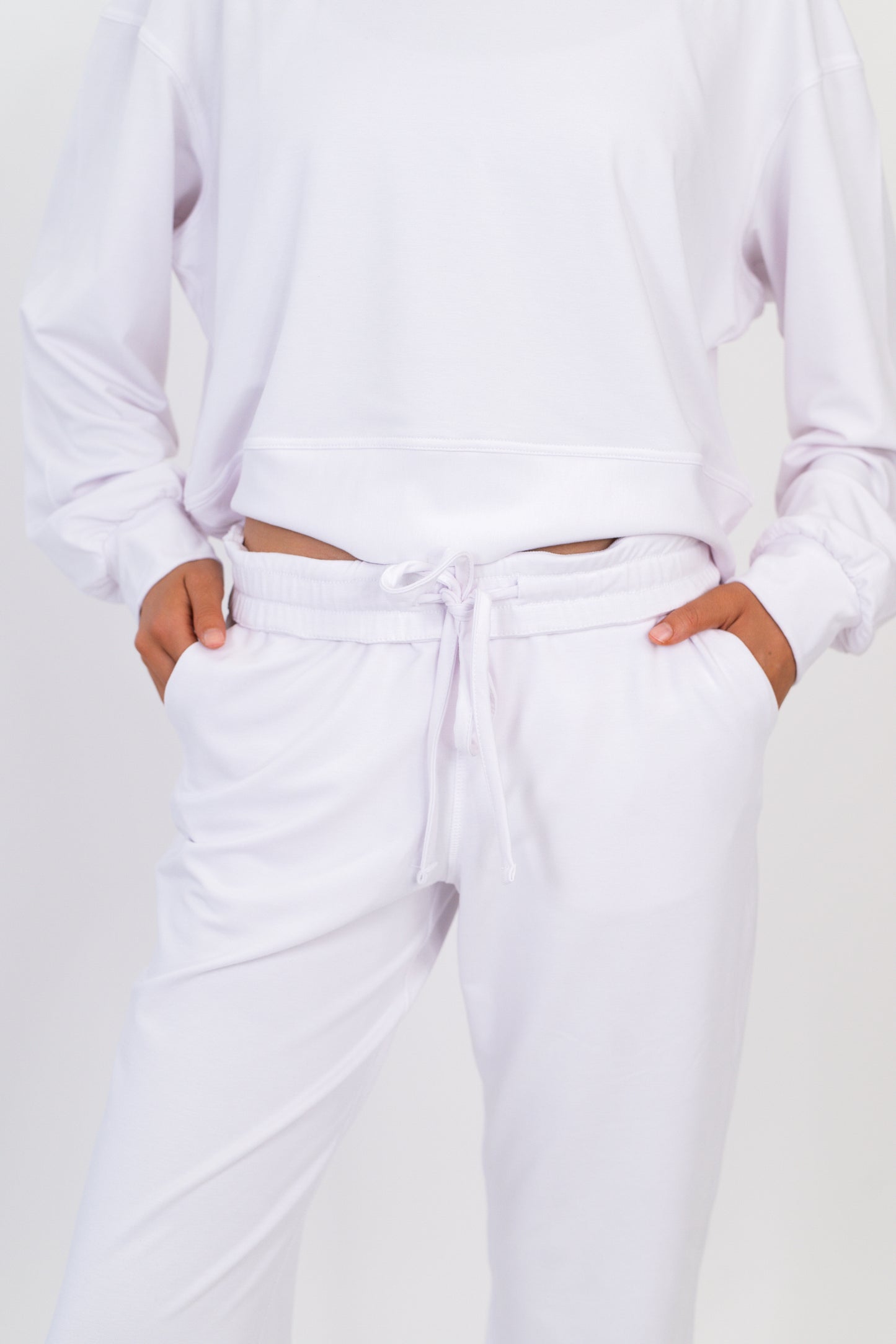 Model wearing The Solace Wide Leg Sweatpant in Cloud by ON/OFF Essentials, made from 95% bamboo fleece.