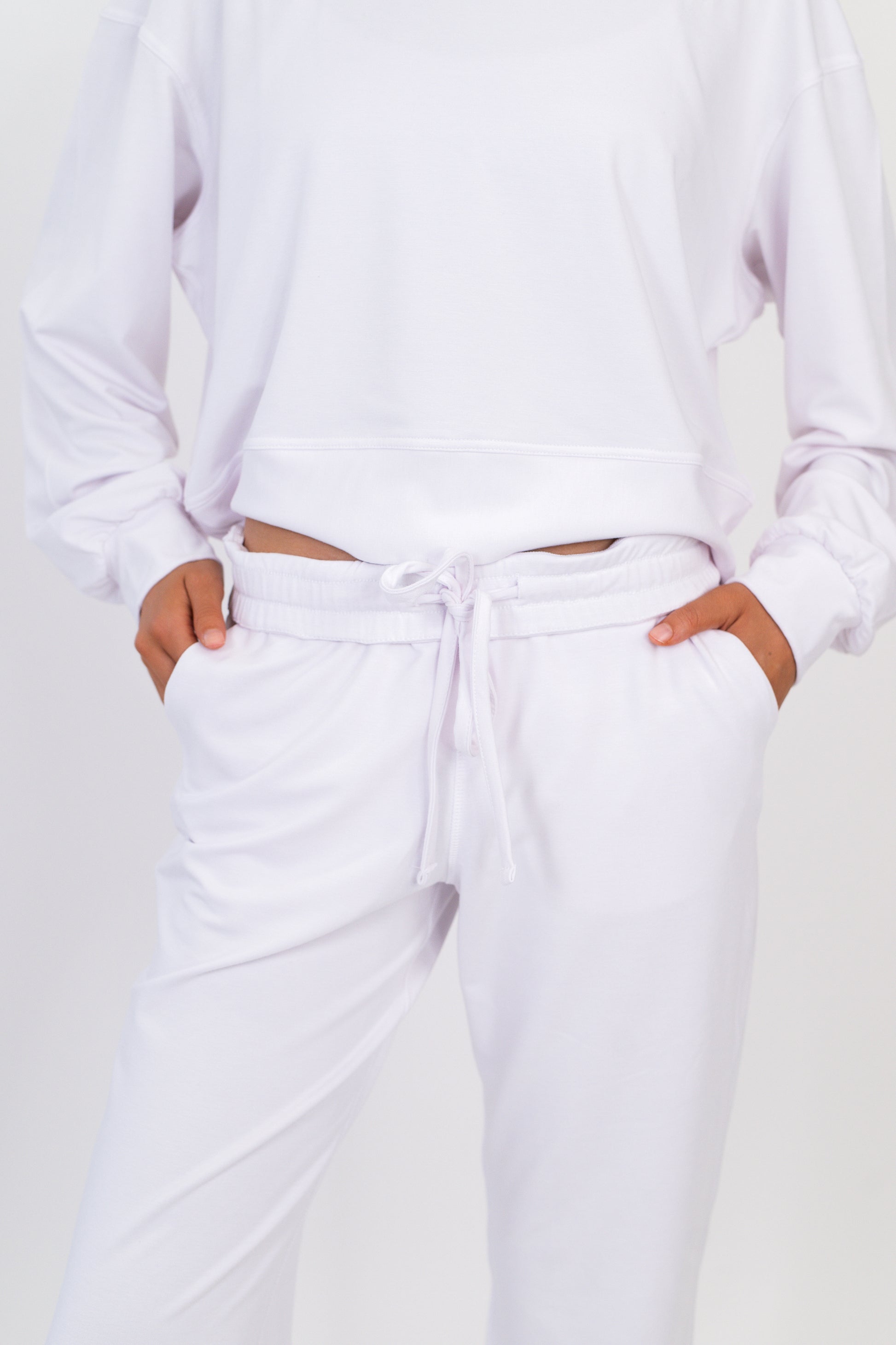 Model wearing The Solace Wide Leg Sweatpant in Cloud by ON/OFF Essentials, made from 95% bamboo fleece.