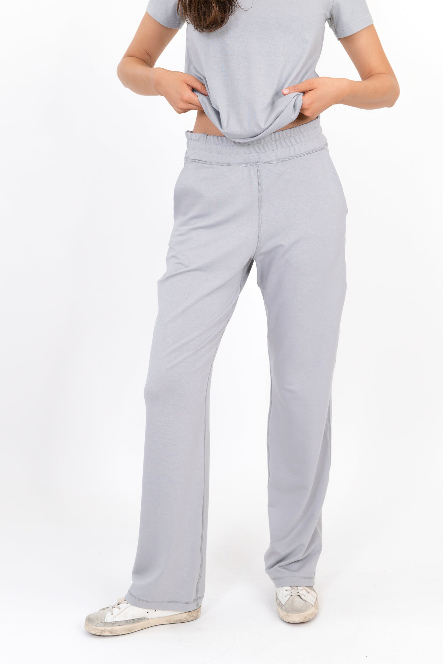 Model wearing The Solace Wide Leg Sweatpant in Fog by ON/OFF Essentials, made from 95% bamboo fleece.