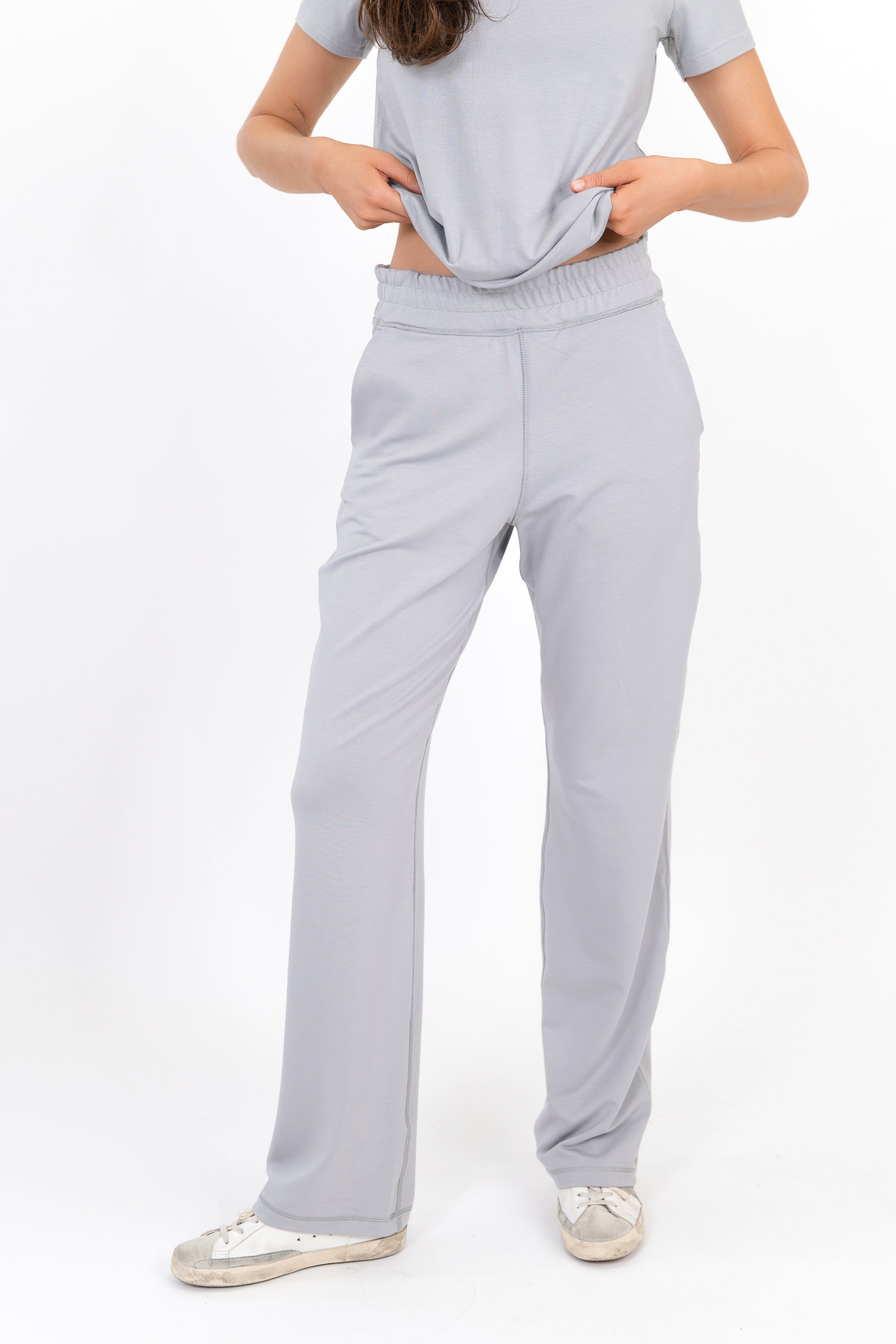 Model wearing The Solace Wide Leg Sweatpant in Fog by ON/OFF Essentials, made from 95% bamboo fleece.