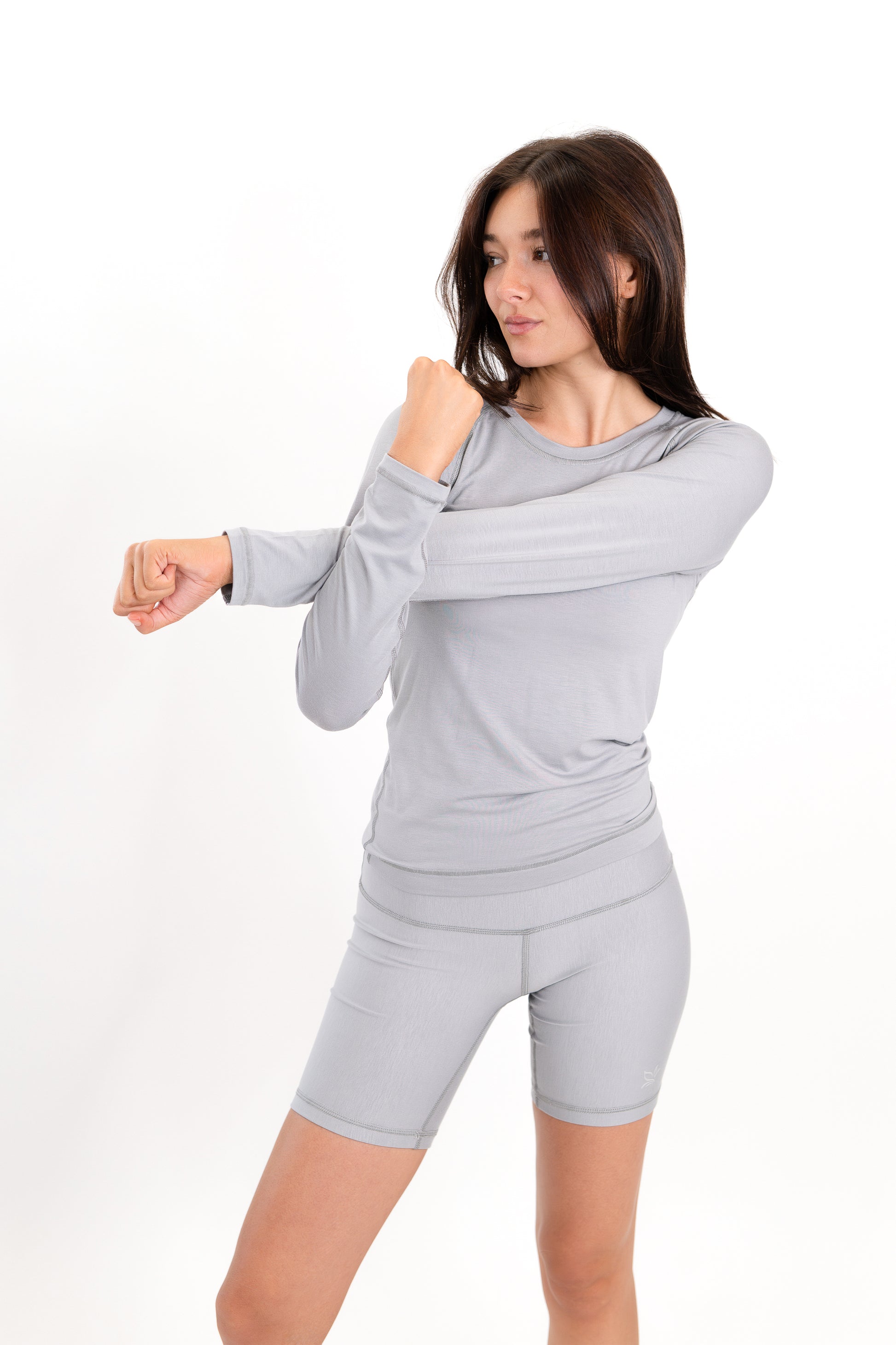 Model wearing The Core Short 5” in Fog by ON/OFF Essentials, made from 95% bamboo.