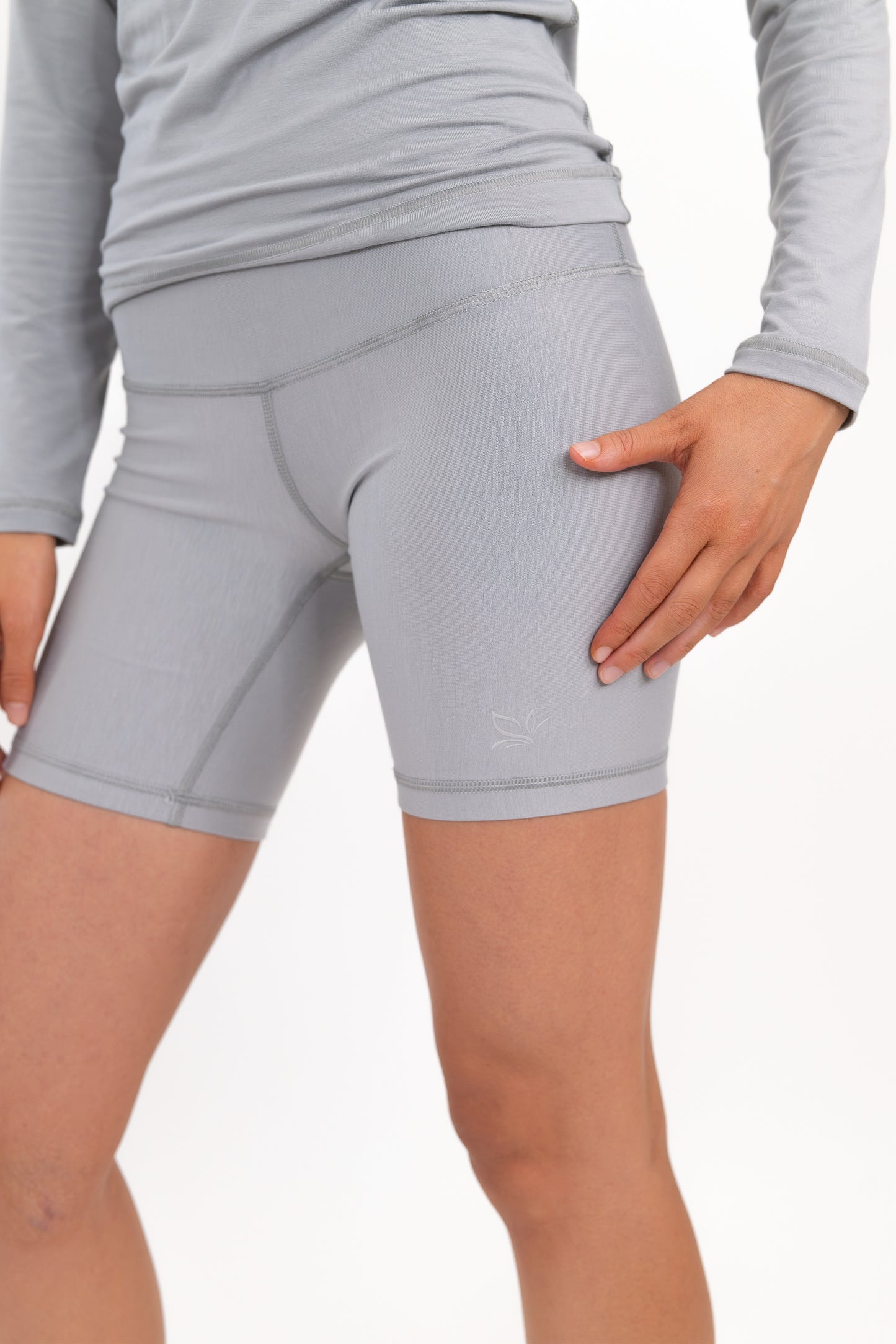 Model wearing The Core Short 5” in Fog by ON/OFF Essentials, made from 95% bamboo.