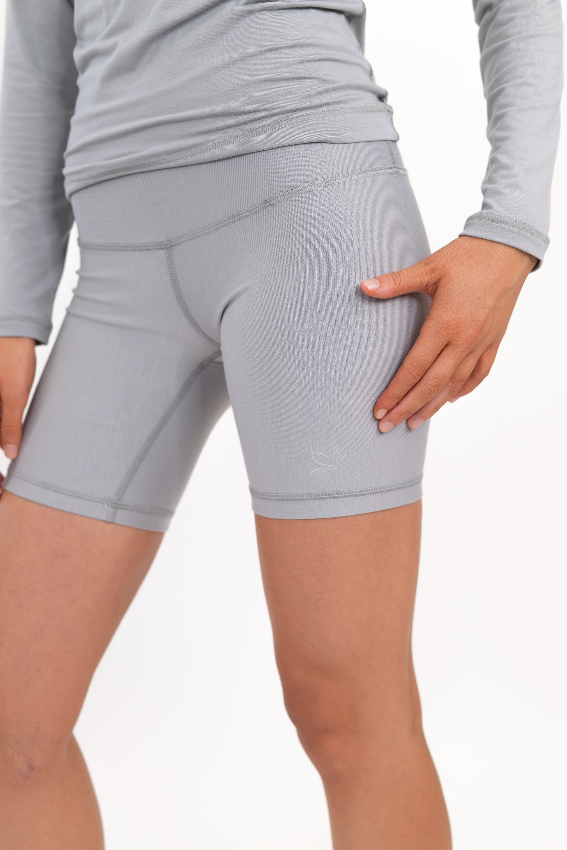 Model wearing The Core Short 5” in Fog by ON/OFF Essentials, made from 95% bamboo.