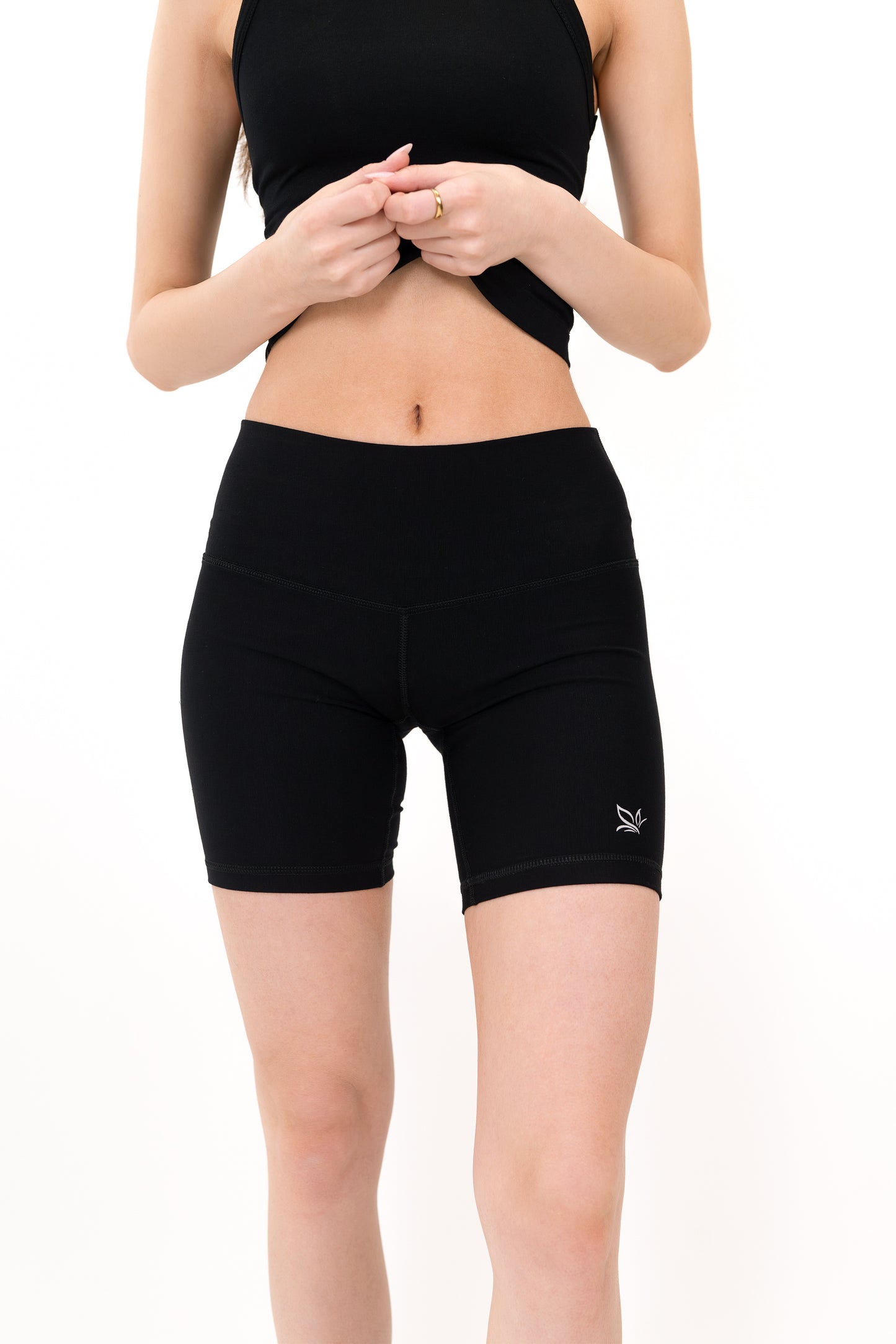 Model wearing The Core Short 5” in Onyx by ON/OFF Essentials, made from 95% bamboo.