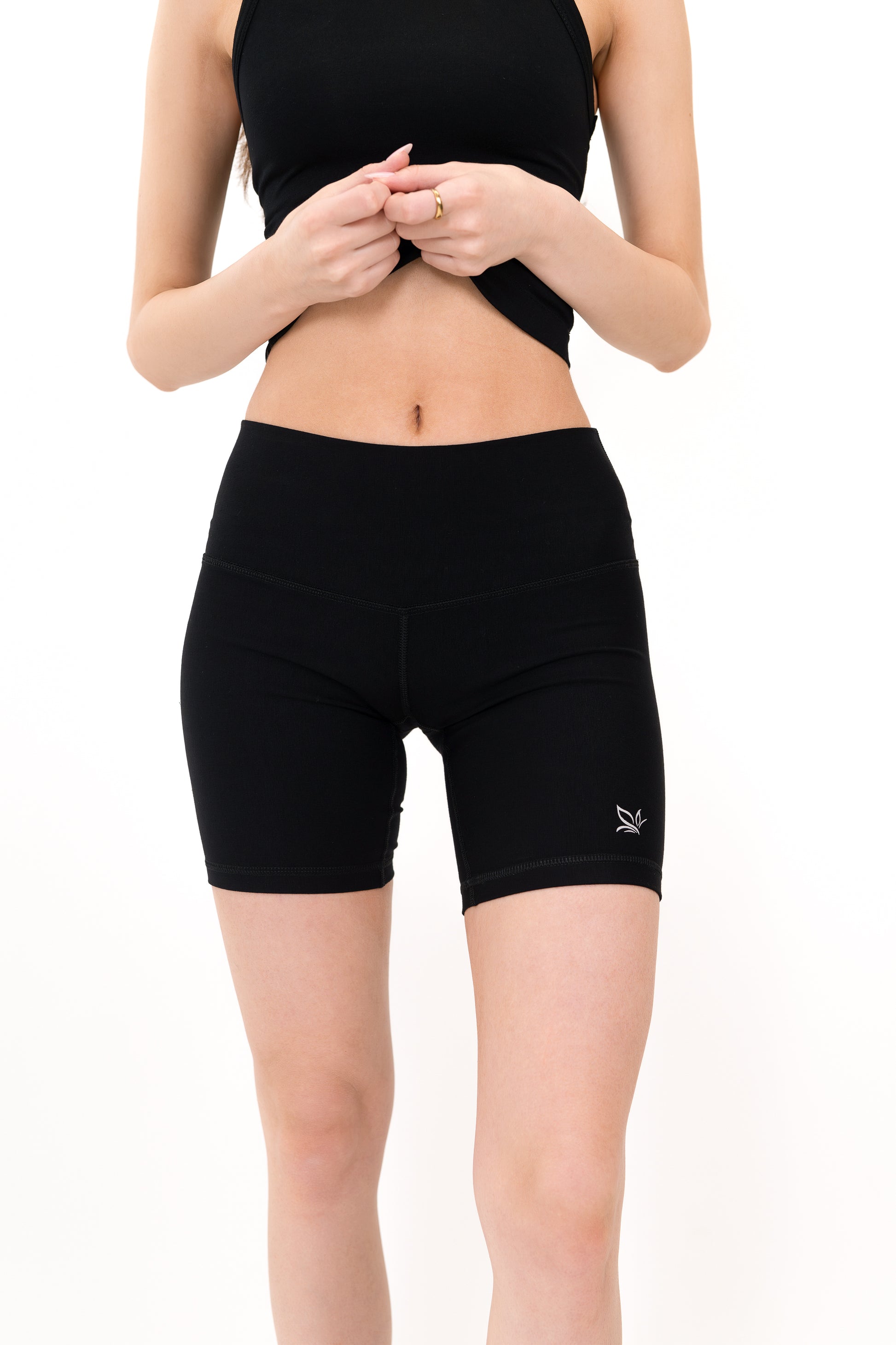 Model wearing The Core Short 5” in Onyx by ON/OFF Essentials, made from 95% bamboo.