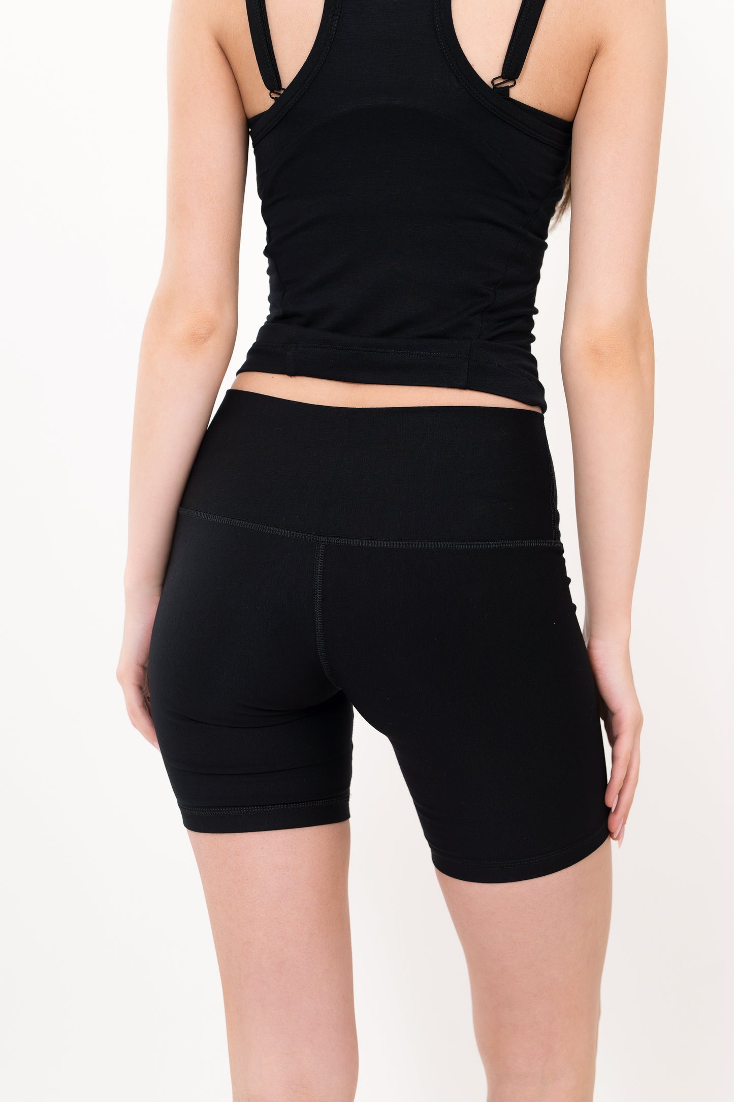 Model wearing The Core Short 5” in Onyx by ON/OFF Essentials, made from 95% bamboo.
