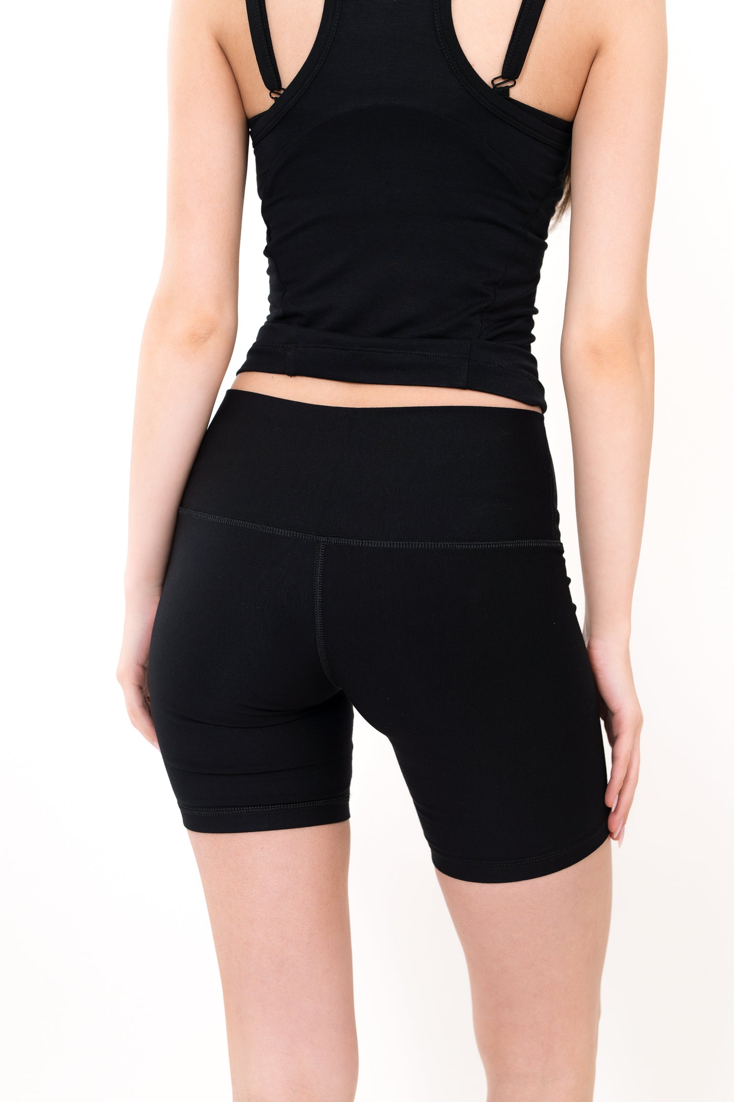 Model wearing The Core Short 5” in Onyx by ON/OFF Essentials, made from 95% bamboo.