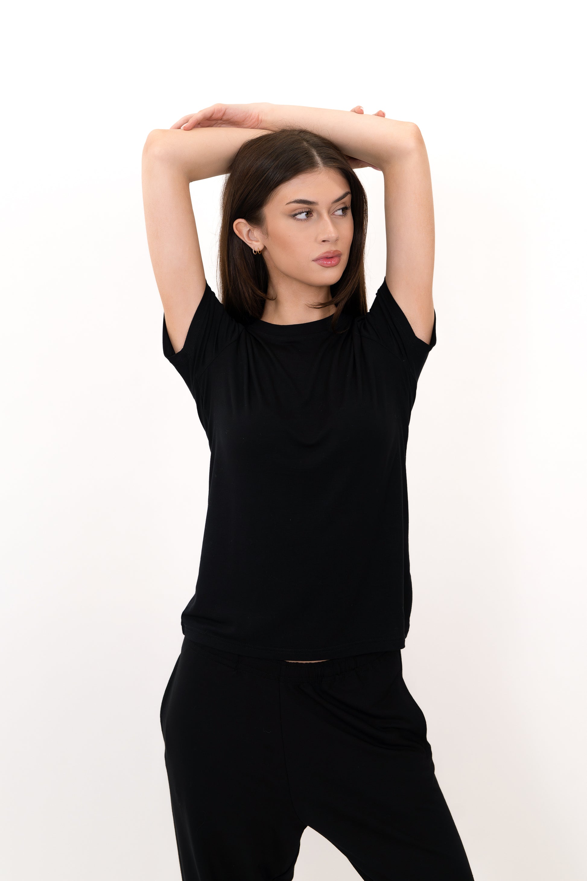 Model wearing The Everyday Tee in Onyx by ON/OFF Essentials, made from 95% bamboo.