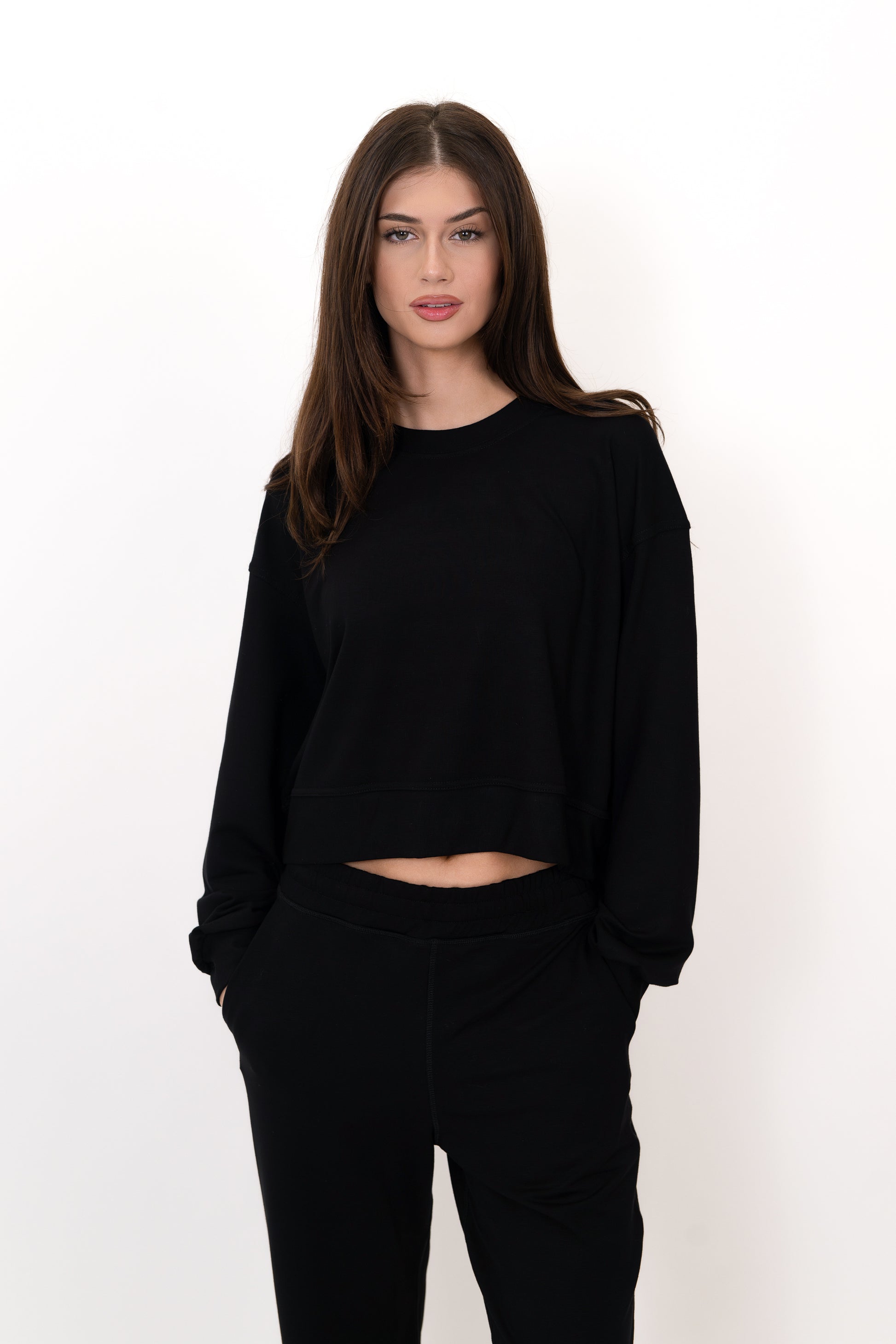 Model wearing The Solace Crew Neck in Onyx by ON/OFF Essentials, made from 95% bamboo fleece.