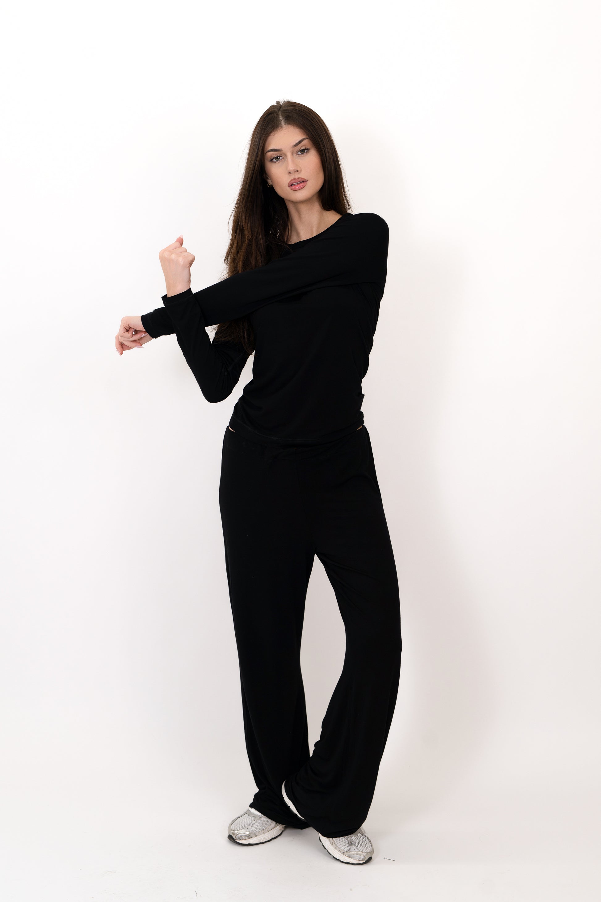 Model wearing The Everyday Long Sleeve in Onyx by ON/OFF Essentials, made from 95% bamboo.