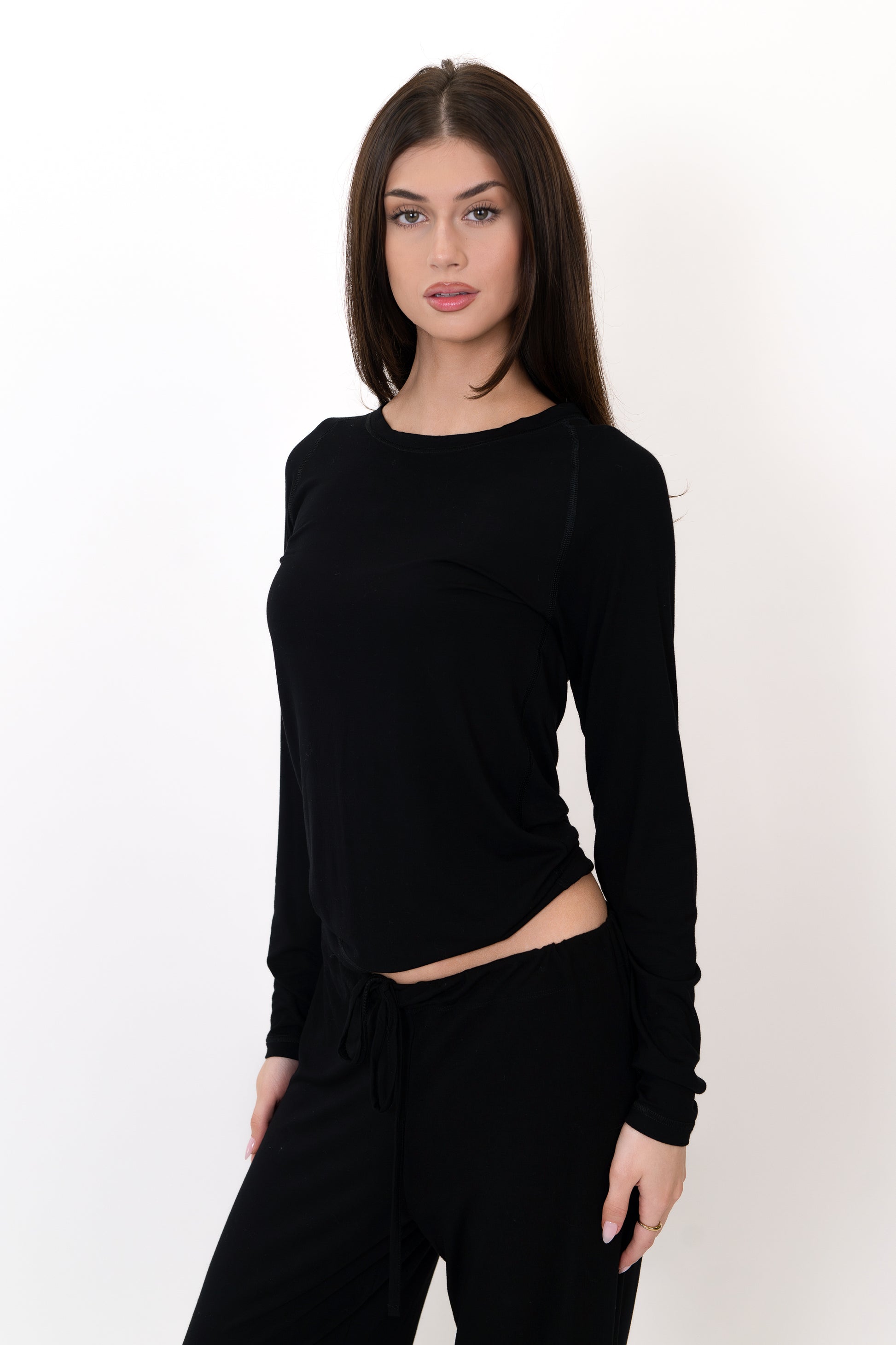 Model wearing The Everyday Long Sleeve in Onyx by ON/OFF Essentials, made from 95% bamboo.