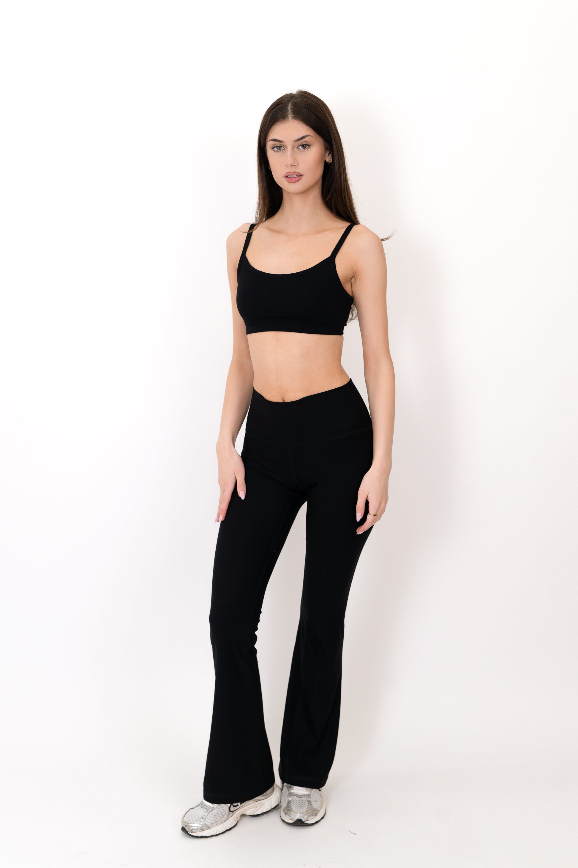 Model wearing The Core Flare Legging in Onyx by ON/OFF Essentials, made from 95% bamboo.