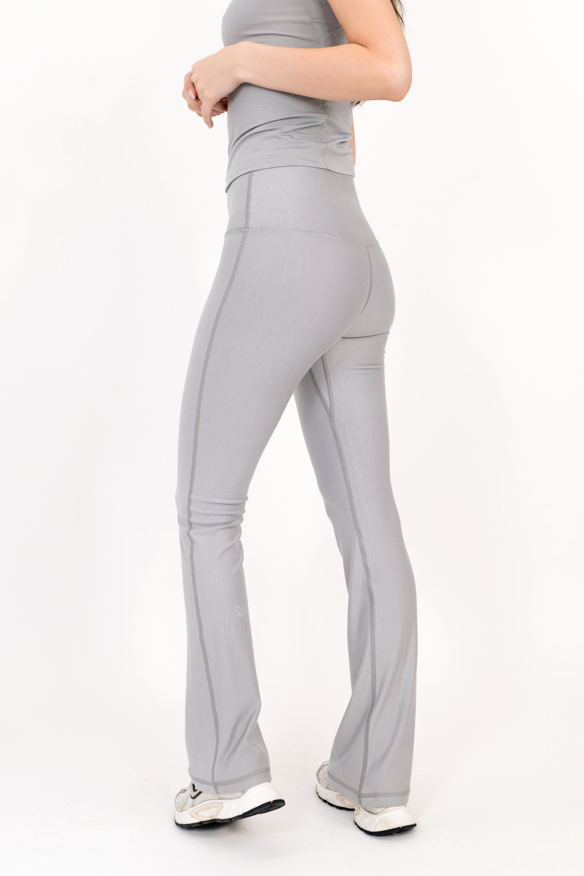 Model wearing The Core Flare Legging in Fog by ON/OFF Essentials, made from 95% bamboo.