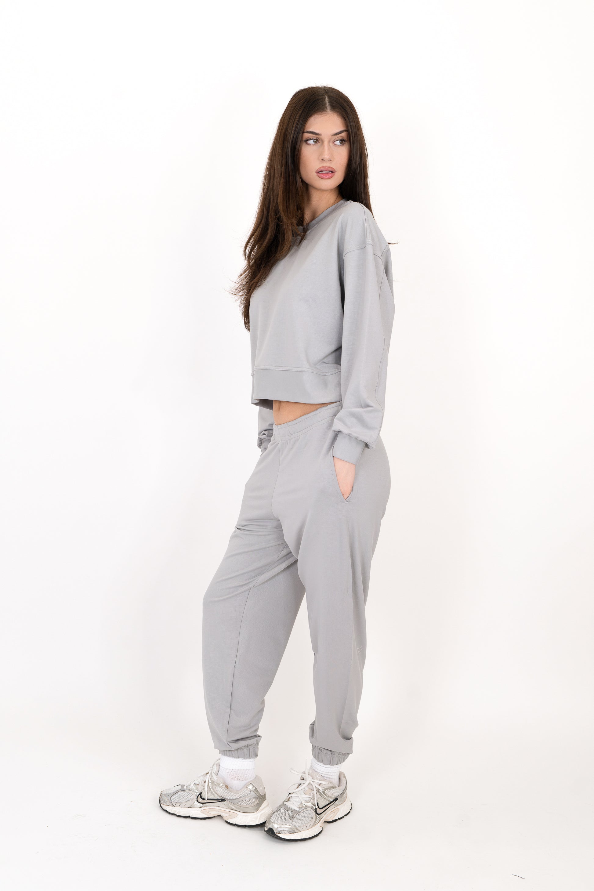 Model wearing The Solace Sweatpant in Fog by ON/OFF Essentials, made from 95% bamboo fleece.