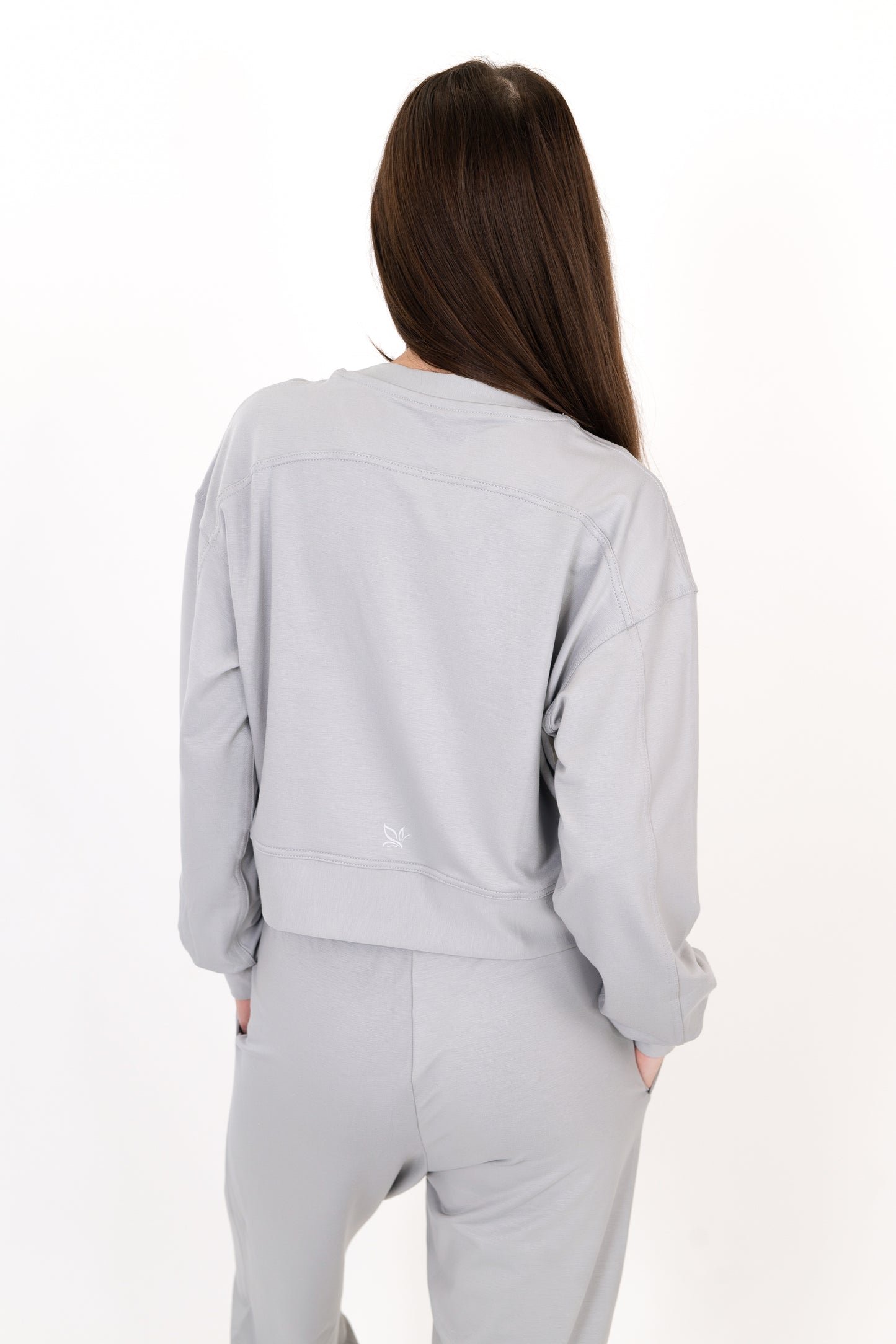 Model wearing The Solace Crew Neck in Fog by ON/OFF Essentials, made from 95% bamboo fleece.